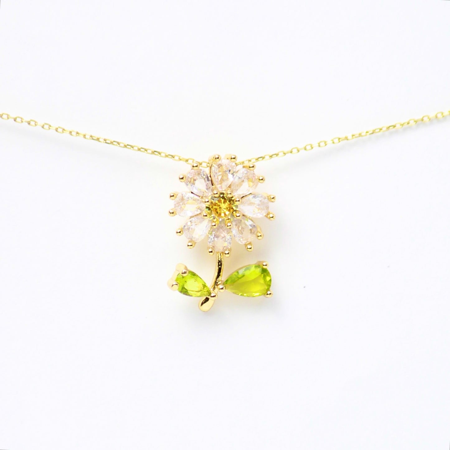 Dije “Fleur de Vie” con petalos de Zirconias y hojas de Diamantes en gota, Oro laminado