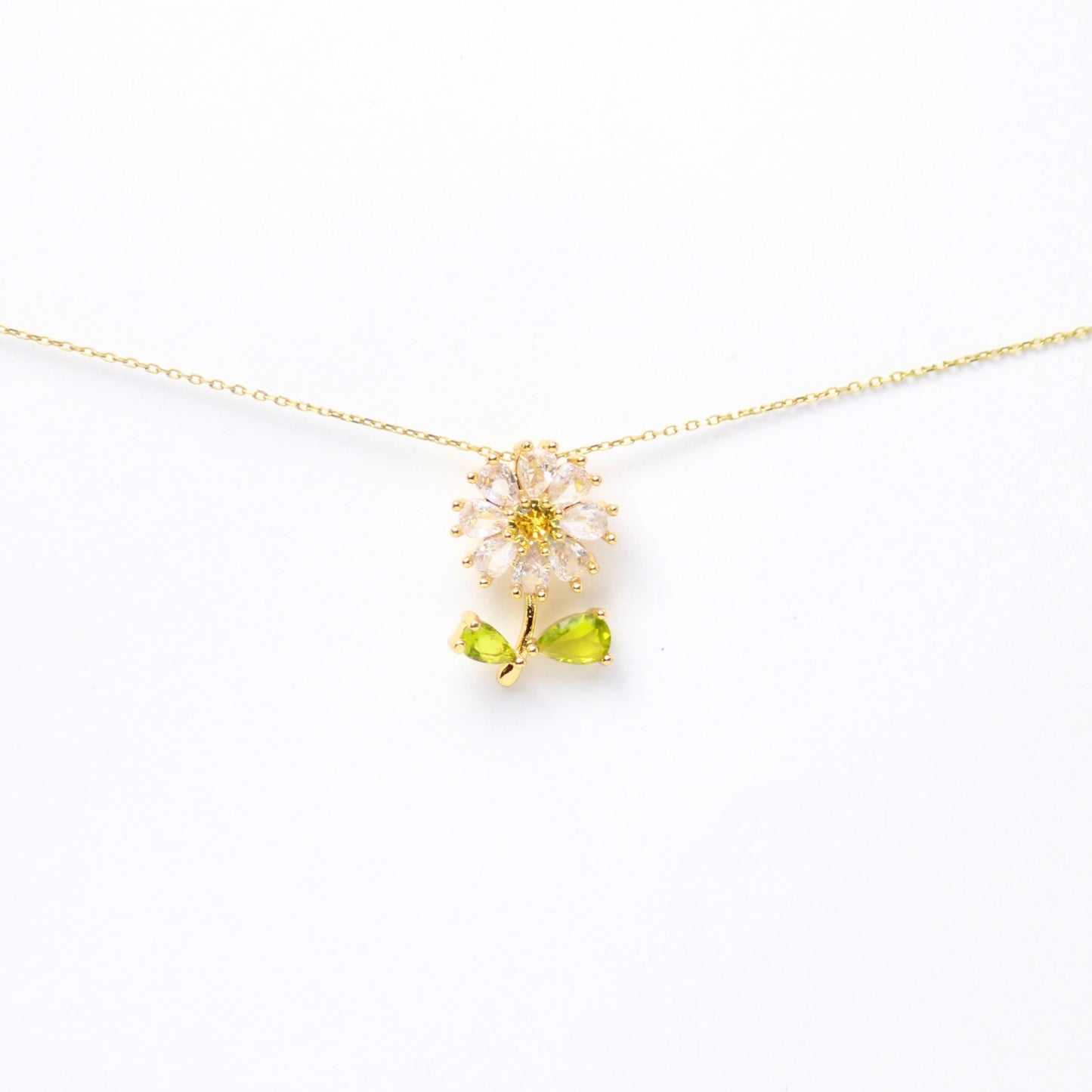 Dije “Fleur de Vie” con petalos de Zirconias y hojas de Diamantes en gota, Oro laminado