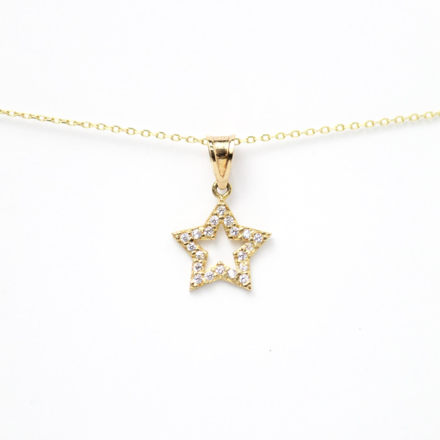 Dije de Estrella abierta con Zirconias alrededor del marco, Oro 10k